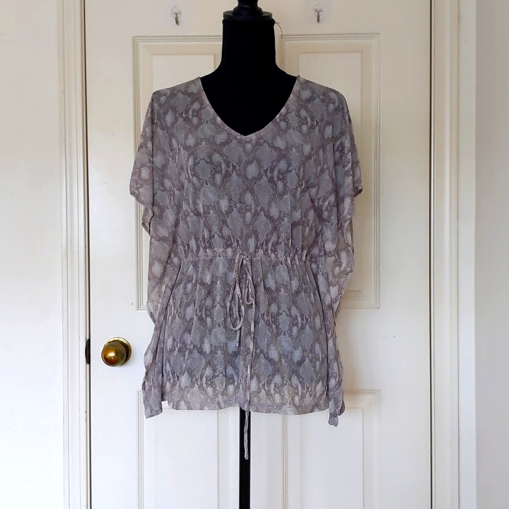 NWT. The Limited Multi Color Pattern Dropped Shoulder Blouse w/waist string tie.